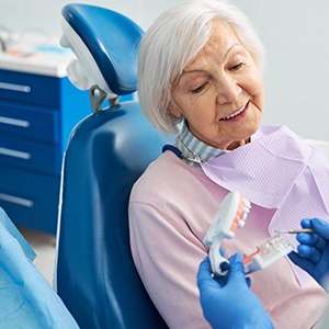 Older woman listening to dentist during consultation