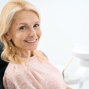 Older woman smiling with new dental implants